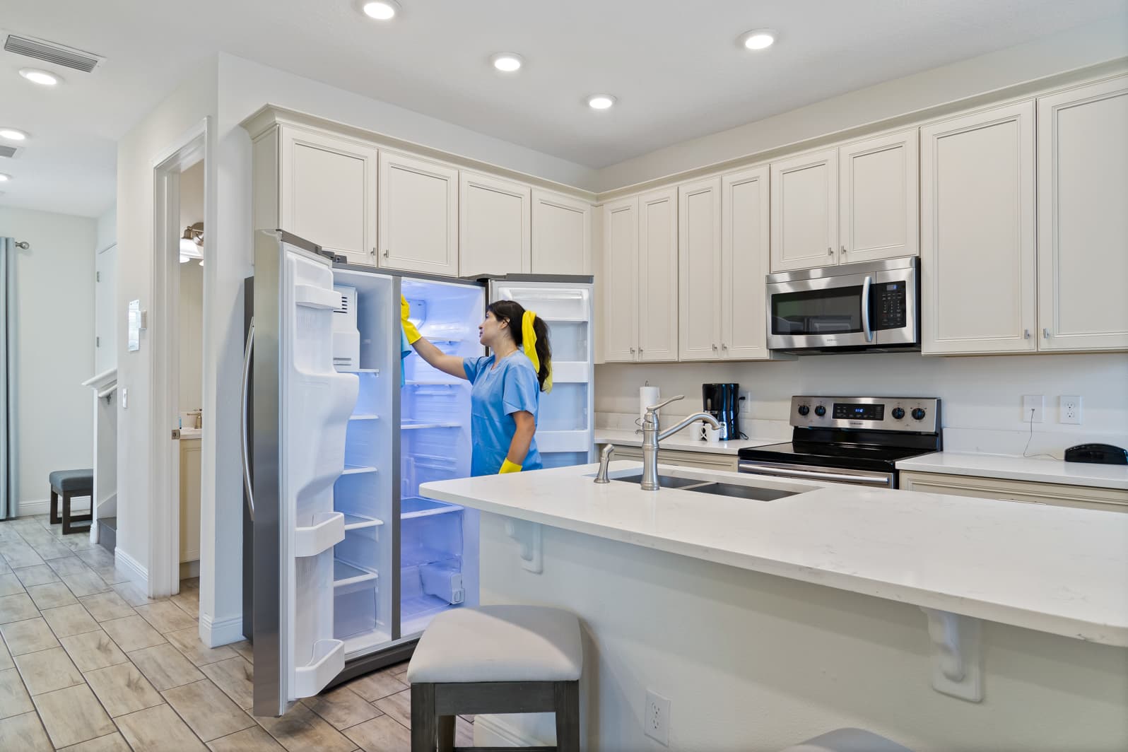 M&M Sunshine cleaning professional with AAA Four Diamond award